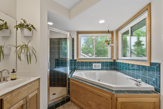 5278 River Wood Dr, Savage, MN 55378 - bathroom featuring a stall shower, vanity, and a jetted tub
