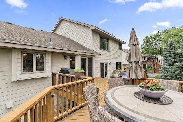 5278 River Wood Dr, Savage, MN 55378 - deck with stairway, outdoor dining area, and grilling area