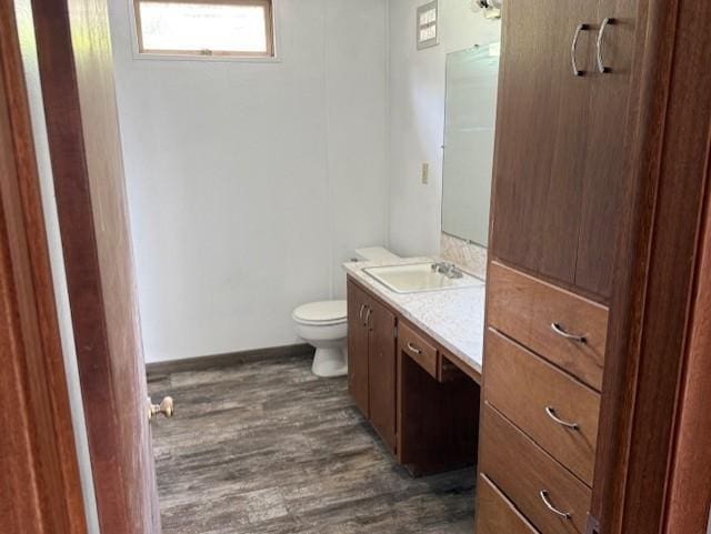 103 Circle Dr, Jackson, MN 56143 - half bathroom with vanity and wood finished floors