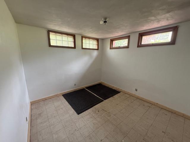 103 Circle Dr, Jackson, MN 56143 - spare room featuring tile patterned floors