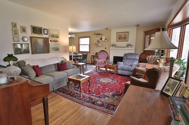 1138 Wintergreen Ln NE, Bemidji, MN 56601 - living room with wood finished floors and a fireplace