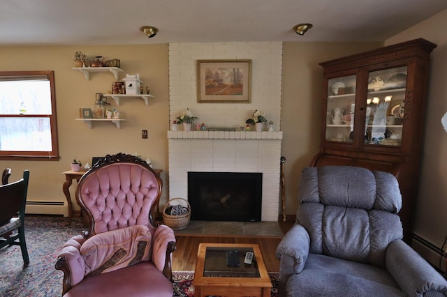 1138 Wintergreen Ln NE, Bemidji, MN 56601 - living area with baseboard heating and a brick fireplace