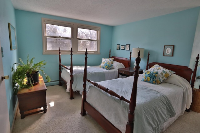 1138 Wintergreen Ln NE, Bemidji, MN 56601 - bedroom featuring light colored carpet, a baseboard radiator, and a textured ceiling