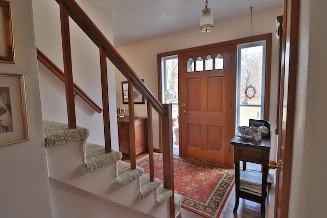 1138 Wintergreen Ln NE, Bemidji, MN 56601 - entryway with plenty of natural light, stairs, and wood finished floors