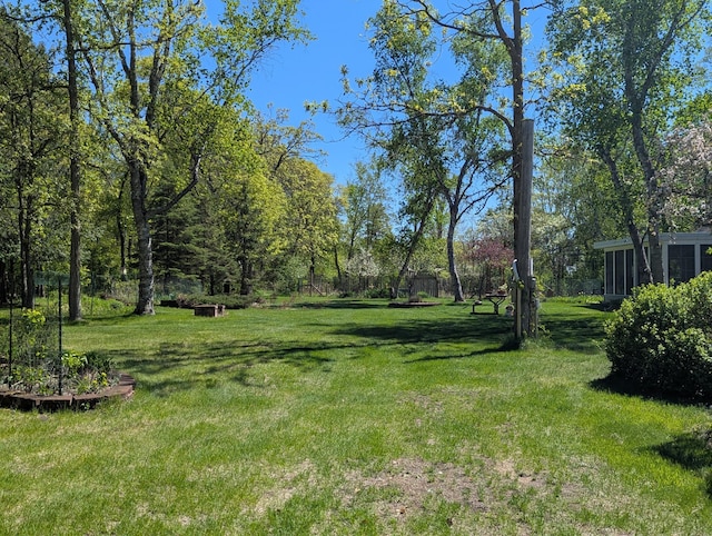 1138 Wintergreen Ln NE, Bemidji, MN 56601 - view of green lawn featuring a sunroom