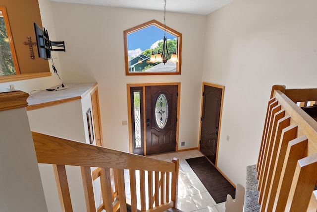 17317 Faraday Ct, Lakeville, MN 55024 - foyer entrance featuring a high ceiling, a chandelier, and light tile patterned floors