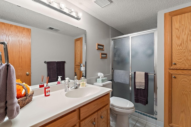 17317 Faraday Ct, Lakeville, MN 55024 - full bath featuring a textured ceiling, vanity, a stall shower, and tile patterned floors