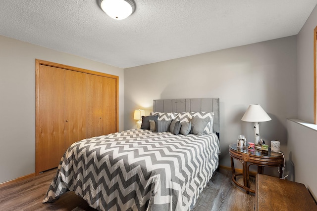 17317 Faraday Ct, Lakeville, MN 55024 - bedroom with wood finished floors, a closet, and a textured ceiling