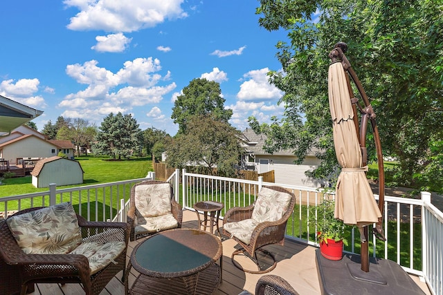 17317 Faraday Ct, Lakeville, MN 55024 - deck featuring a storage shed and a lawn