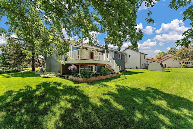 17317 Faraday Ct, Lakeville, MN 55024 - rear view of property with stairs, a wooden deck, and a lawn