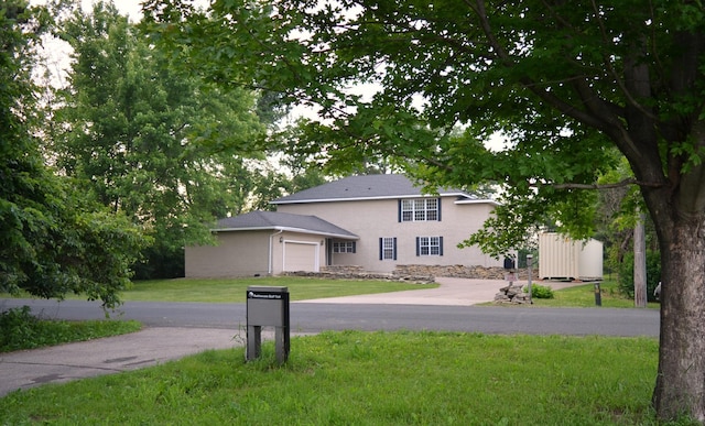 30155 Lakeview Ave, Wacouta Twp, MN 55066 - view of front facade featuring a garage, a front lawn, and stucco siding