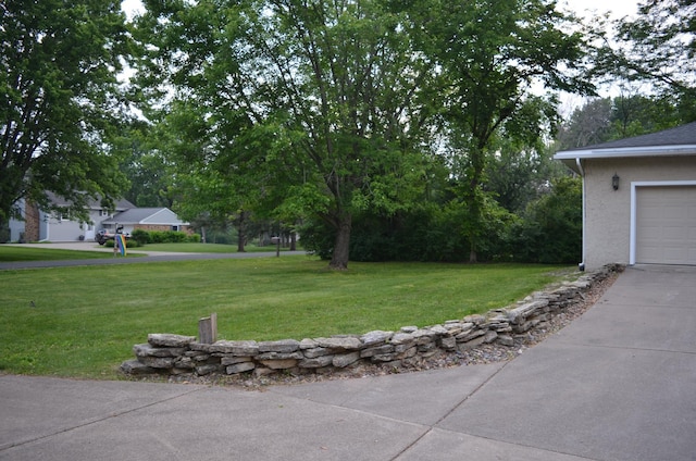 30155 Lakeview Ave, Wacouta Twp, MN 55066 - view of grassy yard with driveway and a garage