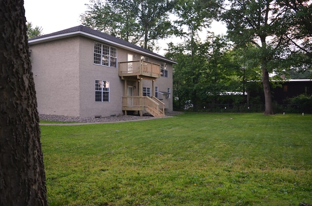 30155 Lakeview Ave, Wacouta Twp, MN 55066 - rear view of house featuring stucco siding, a yard, and a balcony
