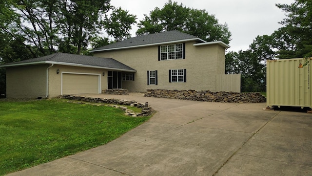 30155 Lakeview Ave, Wacouta Twp, MN 55066 - view of front of home featuring stucco siding, a front lawn, driveway, and an attached garage