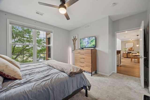 1020 Portland Ave, Minneapolis, MN 55404 - bedroom with light carpet and a ceiling fan