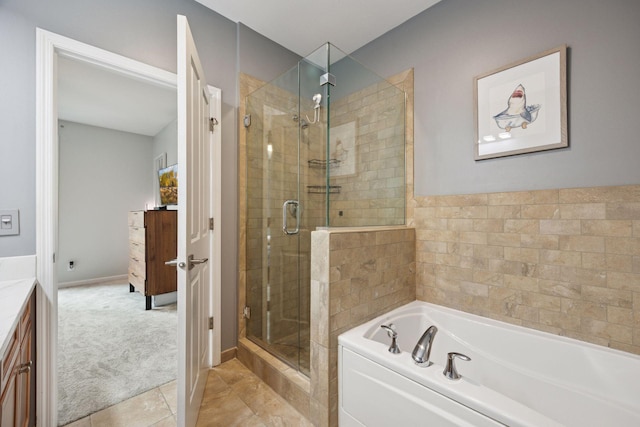 1020 Portland Ave, Minneapolis, MN 55404 - bathroom featuring a stall shower, a bath, tile patterned flooring, and vanity