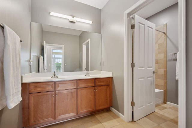 1020 Portland Ave, Minneapolis, MN 55404 - full bath with double vanity,  shower combination, and tile patterned floors