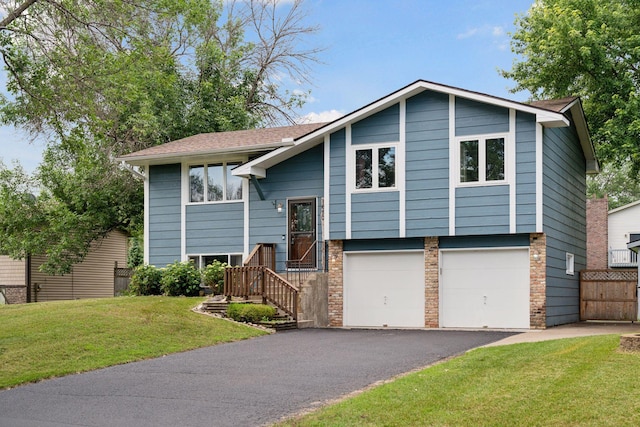 1650 107th Ave NW, Coon Rapids, MN 55433 - split foyer home featuring asphalt driveway, a garage, and a shingled roof