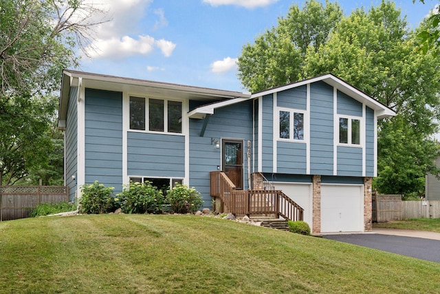 1650 107th Ave NW, Coon Rapids, MN 55433 - bi-level home featuring driveway and a garage