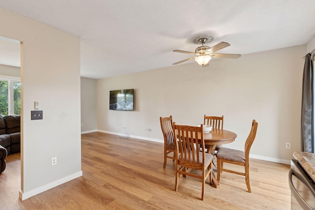 1650 107th Ave NW, Coon Rapids, MN 55433 - dining space featuring ceiling fan and light wood-style floors