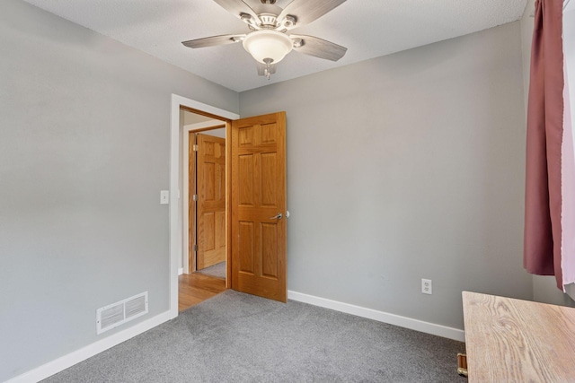 1650 107th Ave NW, Coon Rapids, MN 55433 - carpeted empty room featuring a ceiling fan and baseboards