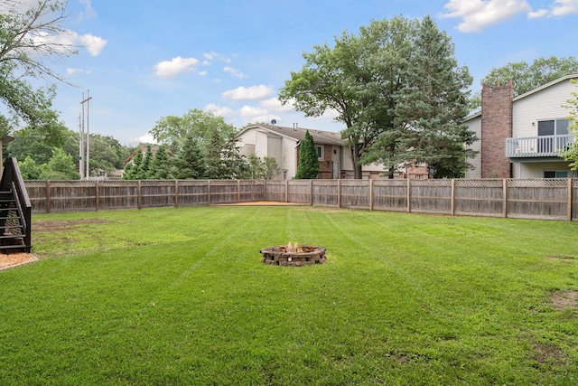 1650 107th Ave NW, Coon Rapids, MN 55433 - fenced backyard with a fire pit and stairs