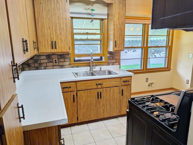 3465 5th St NE, Minneapolis, MN 55418 - kitchen featuring light countertops, healthy amount of natural light, and tasteful backsplash