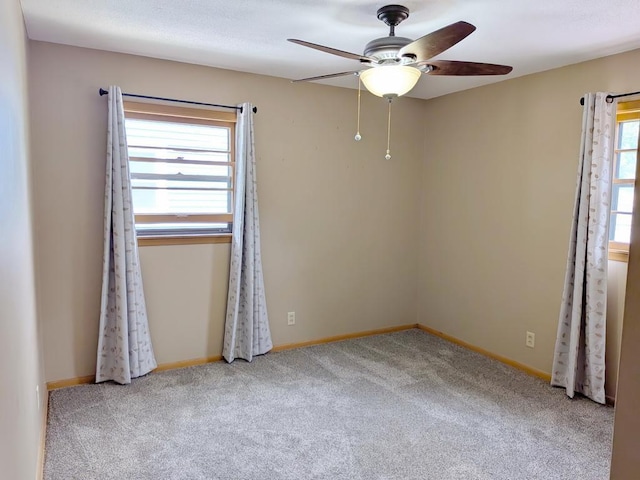 3465 5th St NE, Minneapolis, MN 55418 - carpeted empty room featuring a ceiling fan and baseboards