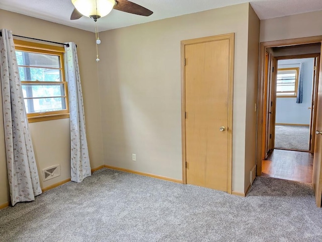 3465 5th St NE, Minneapolis, MN 55418 - unfurnished bedroom with carpet floors and ceiling fan