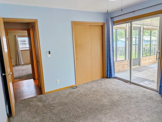 3465 5th St NE, Minneapolis, MN 55418 - unfurnished bedroom featuring carpet flooring and a closet