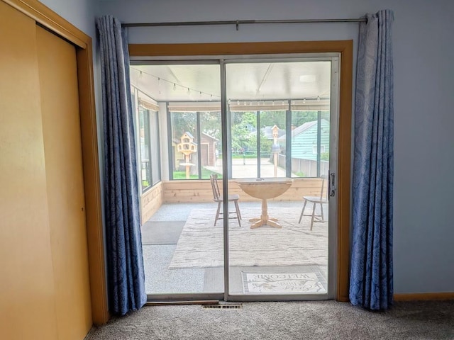 3465 5th St NE, Minneapolis, MN 55418 - doorway to outside with carpet floors