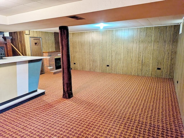 3465 5th St NE, Minneapolis, MN 55418 - finished below grade area with carpet, wooden walls, and a fireplace
