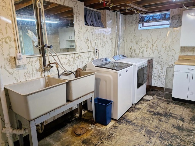 3465 5th St NE, Minneapolis, MN 55418 - laundry area featuring washer and dryer and dark flooring