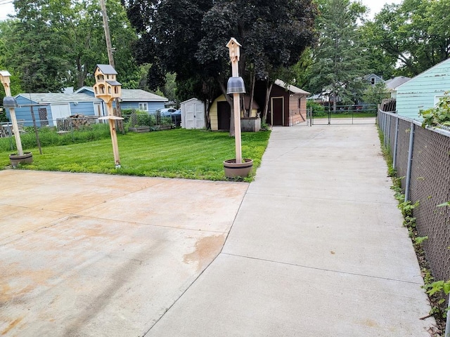 3465 5th St NE, Minneapolis, MN 55418 - view of patio / terrace featuring a storage unit and driveway