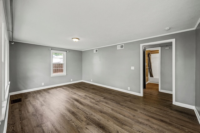 6289 Edgewood Ave N, Brooklyn Park, MN 55428 - spare room featuring ornamental molding, dark wood finished floors, and a smoke detector