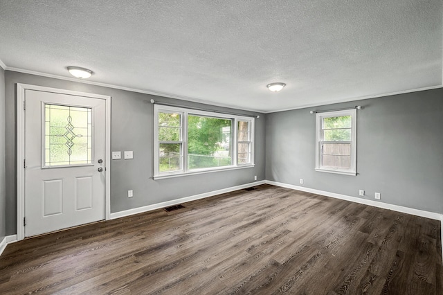 6289 Edgewood Ave N, Brooklyn Park, MN 55428 - foyer with a textured ceiling, crown molding, and dark wood-type flooring