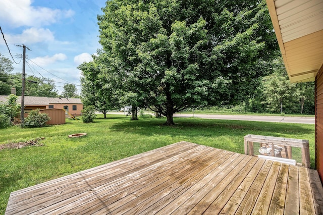 6289 Edgewood Ave N, Brooklyn Park, MN 55428 - wooden deck with a lawn and a fire pit