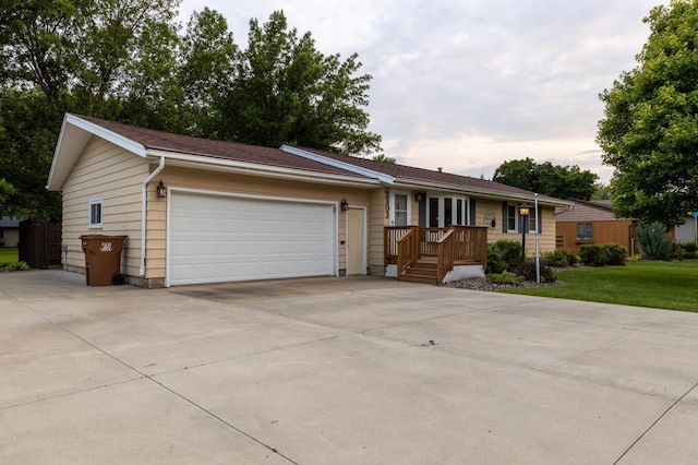 2303 9th Ave SW, Austin, MN 55912 - ranch-style house featuring an attached garage, concrete driveway, and a front lawn