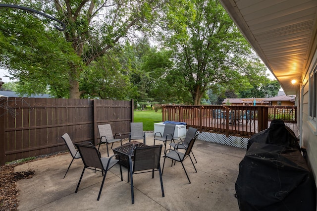 2303 9th Ave SW, Austin, MN 55912 - view of patio / terrace featuring a fire pit and a deck