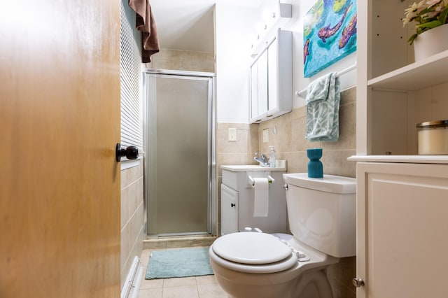 2303 9th Ave SW, Austin, MN 55912 - bathroom featuring tile walls, a stall shower, tile patterned flooring, and vanity