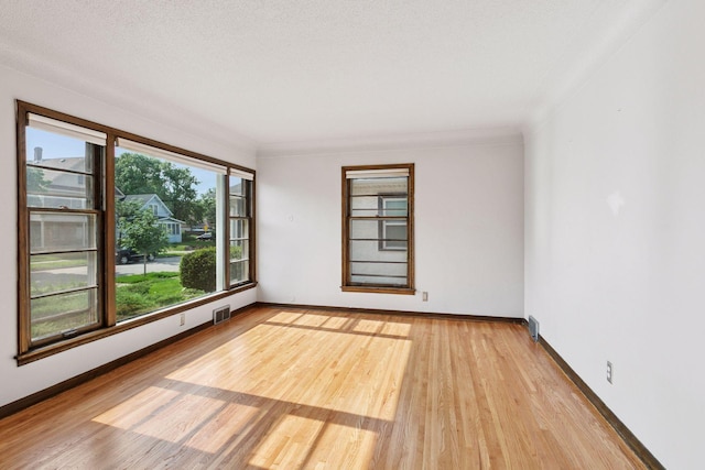 2514 5th St NE, Minneapolis, MN 55418 - spare room featuring light wood-style flooring and baseboards