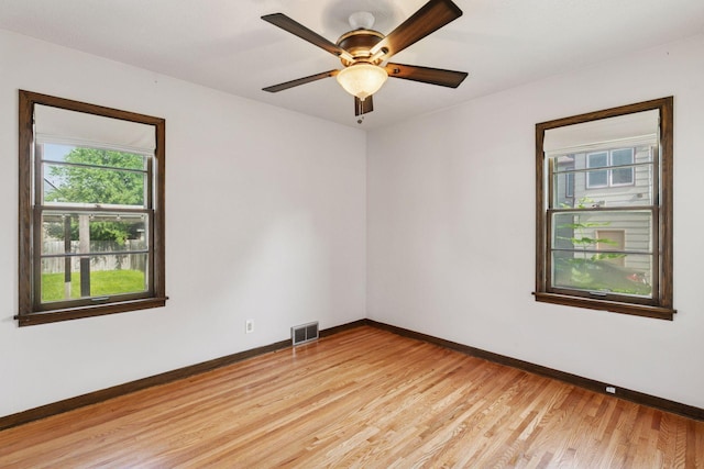 2514 5th St NE, Minneapolis, MN 55418 - spare room with plenty of natural light, light wood-type flooring, and ceiling fan