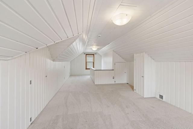 2514 5th St NE, Minneapolis, MN 55418 - bonus room with light carpet, wood walls, and lofted ceiling