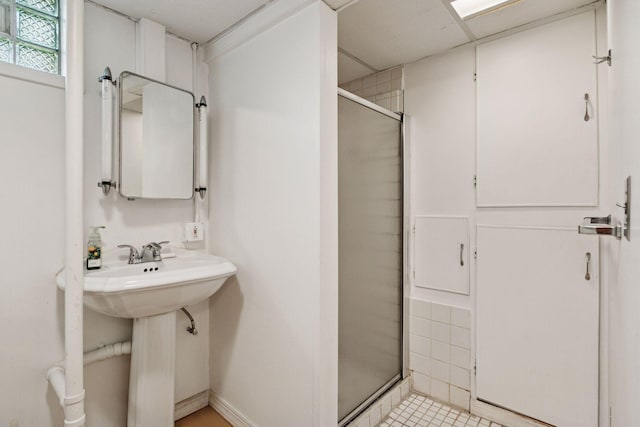 2514 5th St NE, Minneapolis, MN 55418 - full bathroom featuring a stall shower and tile patterned flooring