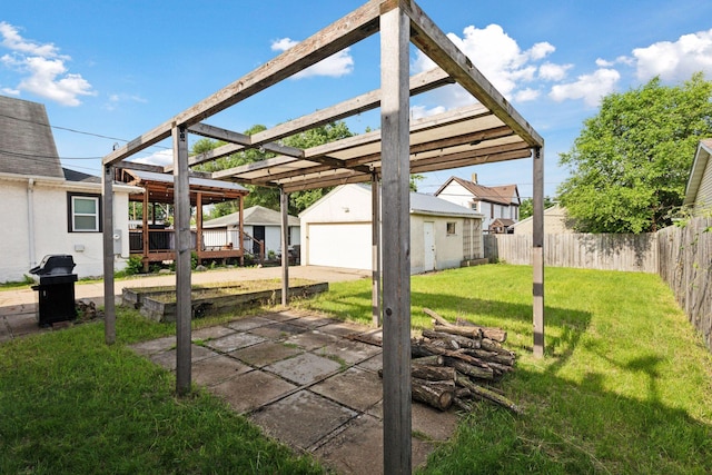 2514 5th St NE, Minneapolis, MN 55418 - view of yard featuring a garage, an outbuilding, and a wooden deck