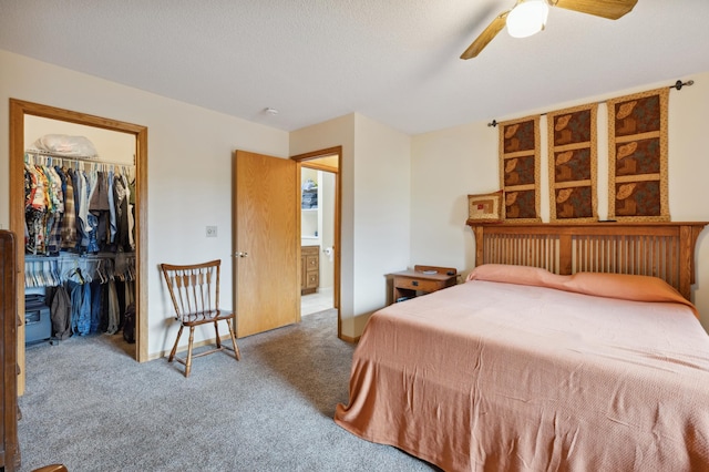3147 94th Ln NE, Blaine, MN 55449 - carpeted bedroom featuring a walk in closet, a closet, and a ceiling fan