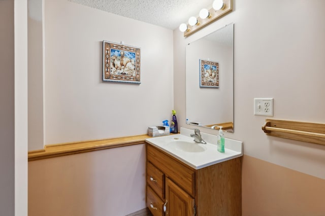 3147 94th Ln NE, Blaine, MN 55449 - bathroom with a textured ceiling and vanity