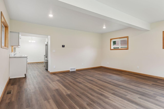 2070 Racine Ave S, Lake Saint Croix Beach, MN 55043 - spare room with a chandelier, dark wood-style flooring, and recessed lighting