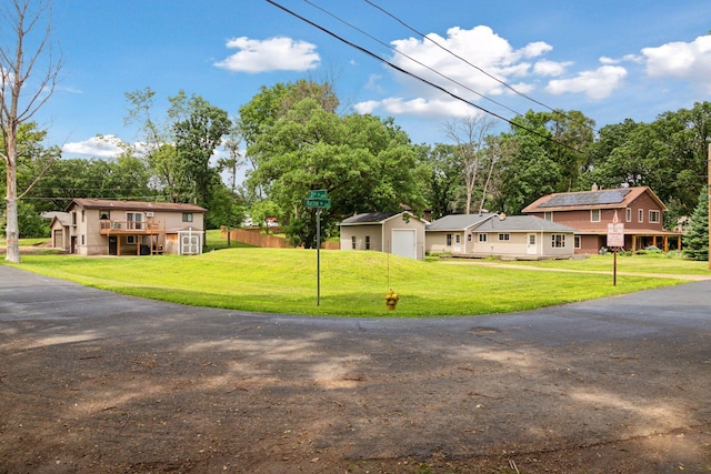 2070 Racine Ave S, Lake Saint Croix Beach, MN 55043 - view of front facade with a front lawn and a detached garage