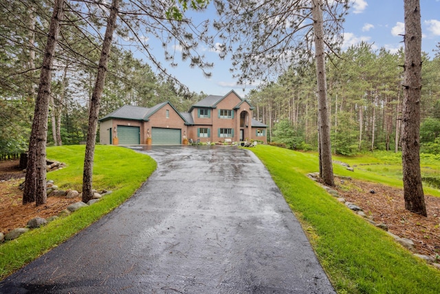 26659 145th St NW, Zimmerman, MN 55398 - view of front facade featuring a garage, a front yard, and driveway